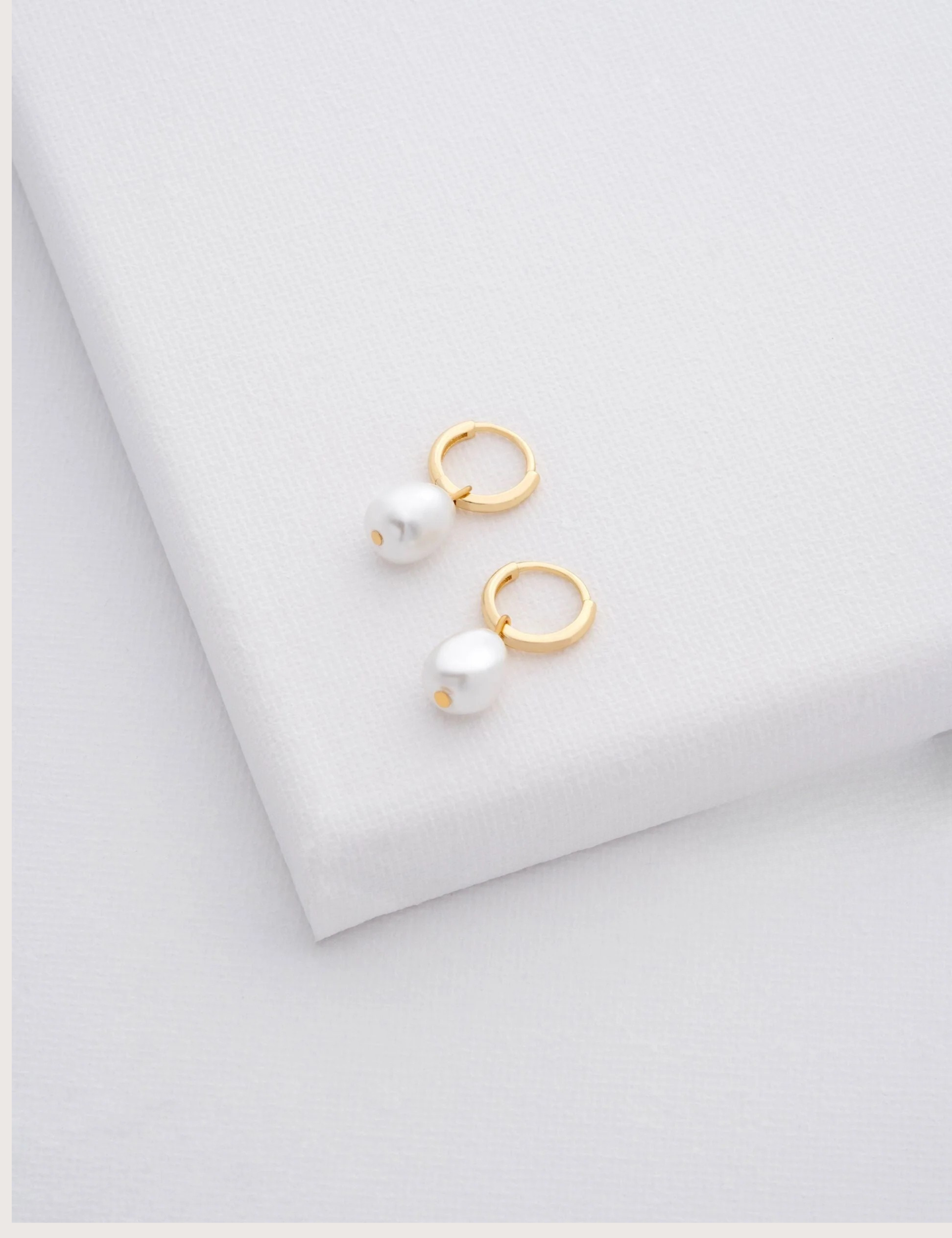 PERIAA: Pearl Huggie Earrings