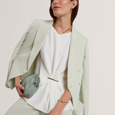 ALAYRA: Draped Bar Detail Top